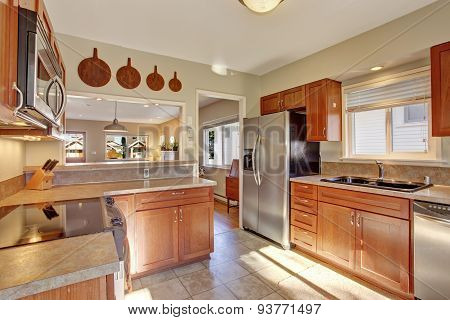 Modern kitchen with tile floor.