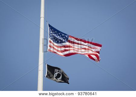 NEW YORK - MAY 25 2015: The American Flag and POW/MIA Flag wave in front of the Soldiers and Sailors Monument in Riverside Park after the Memorial Day Observance service during Fleet Week NY 2015.