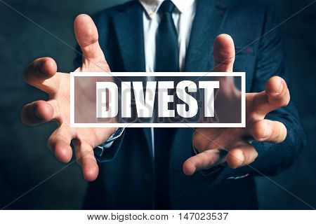 Divest concept with businessman in suit - finance and economics business theme.