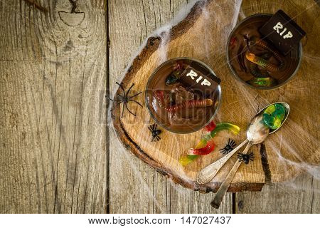 Chocolate mousse with gelly worm with halloween decorations