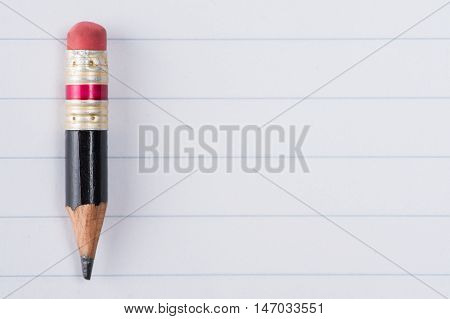 Black Pencil With Pink Eraser On A Paper