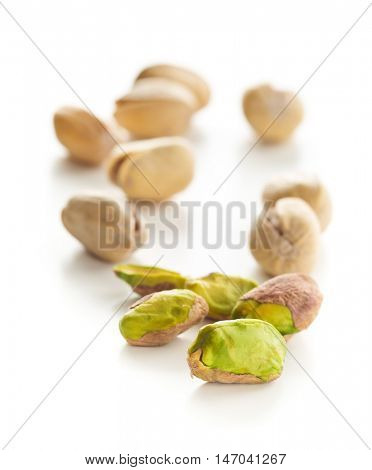 The pistachio nuts isolated on white background.