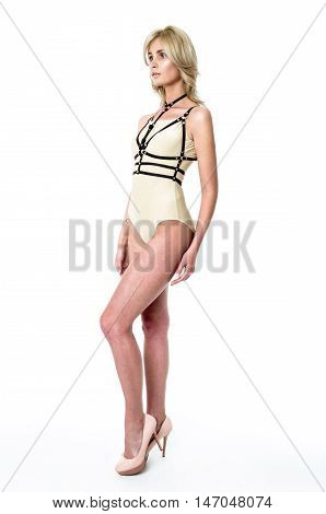 Blonde girl wearing bodysuit and black leather belt