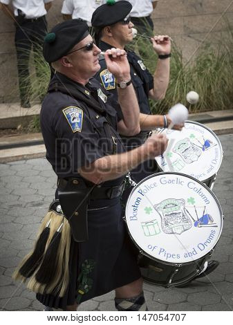 NEW YORK-SEPT 9 2016: Boston Gaelic Pipes & Drums perform in the NYPD Emerald Society Pipe and Drums 9/11 Memorial Procession on the 15th anniversary of the terror attacks.
