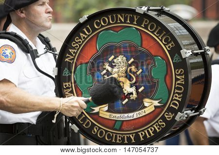 NEW YORK - SEPT 9 2016: Nassau County Pipes and Drums perform in the NYPD Emerald Society Pipe and Drums 9/11 Memorial Procession and Commemoration Service on 15th anniversary of the terror attacks.
