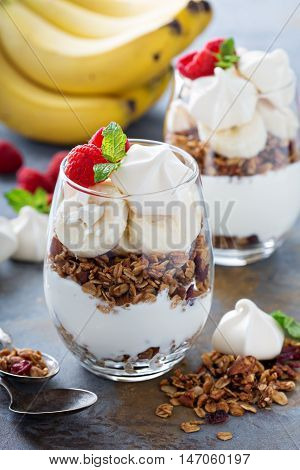 Banana and granola breakfast parfait with meringue
