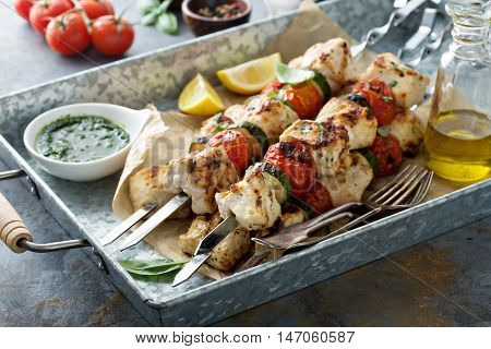 Grilled chicken cabobs on skewers with vegetables