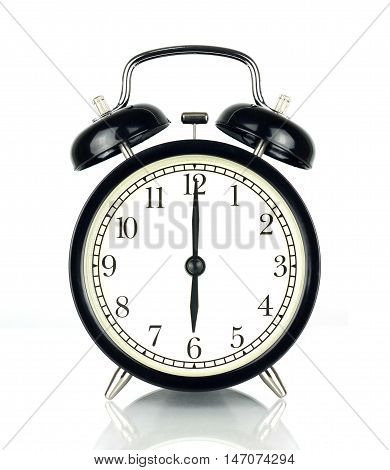 Alarm Clock isolated on white in black and white showing six o'clock.