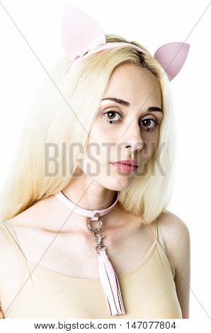Blonde girl wearing bodysuit and leather chocker and ears