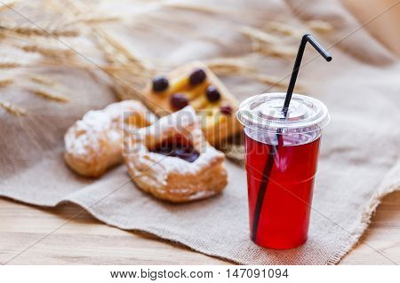 Fresh Compote Of Dried Fruits In Plastic Cups On Rustic Table Wi