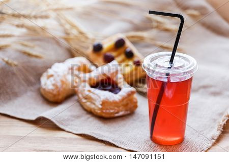 Fresh Compote Of Dried Fruits In Plastic Cups On Rustic Table Wi