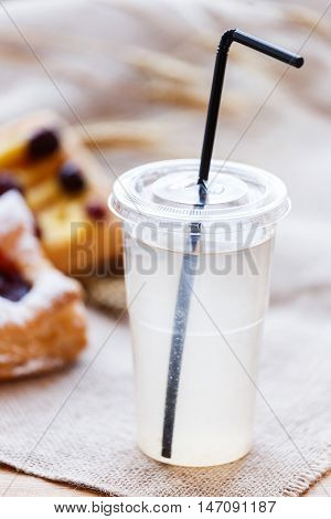 Fresh Compote Of Dried Fruits In Plastic Cups On Rustic Table Wi
