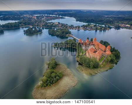 Trakai, Lithuania: aerial UAV top view of Island Castle in the sunrise. Historical residence in capital city of Grand Duchy of Lithuania, located in Galve lake