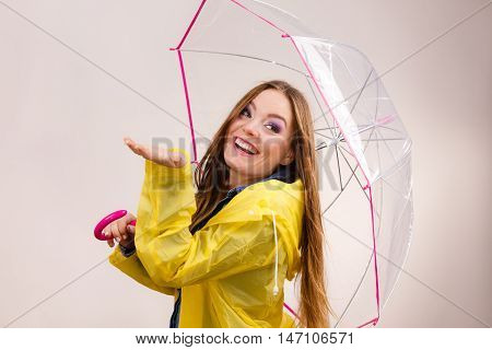 Woman In Rainproof Coat With Umbrella. Forecasting