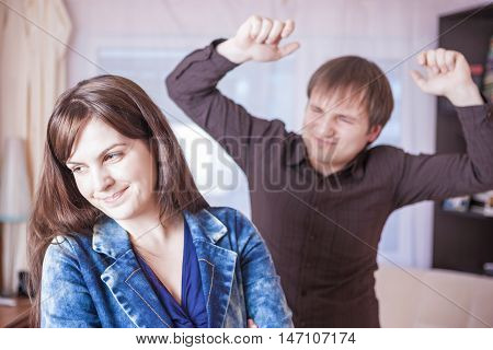 Family Violence Concepts. Young Caucasian Couple Quarrel Indoors.Horizontal Image Orientation