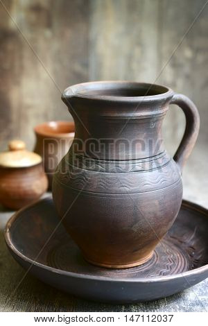 Homemade Pottery On A Rustic Wooden Background .
