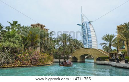 View of Burj Al Arab (Tower of the Arabs) hotel from Madinat Jumeirah hotel Dubai. Madinat is a luxury resort which includes hotels and souk spreding across over 40 hectars.