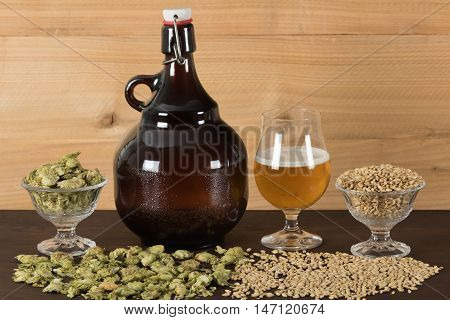 Growler, goblet of beer with hops and malts