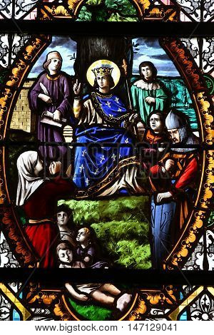 Saint Wandrille Rancon France - june 22 2016 : Saint Louis in a stained glass window of Saint Michel church