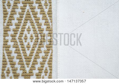 Fragment of hand embroidery on canvas. Background.