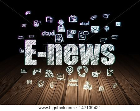 News concept: Glowing text E-news,  Hand Drawn News Icons in grunge dark room with Wooden Floor, black background