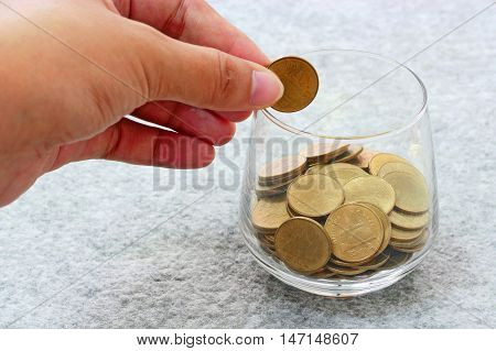 Money In Hand And Money In Glass