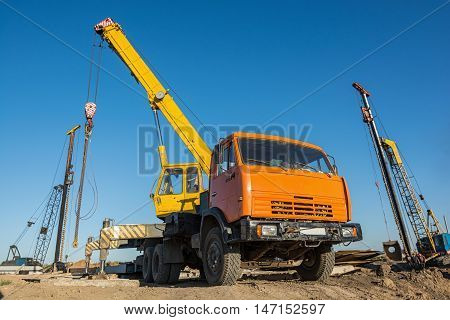 Mobile truck-mounted crane operating at construction site