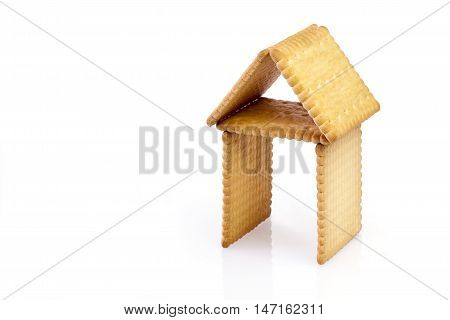 Biscuits in the shape of a house on white backgrond