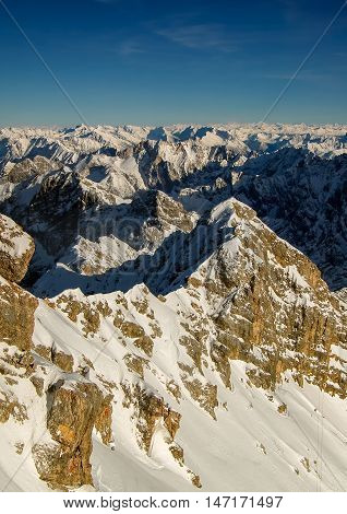 Beautiful View From Highest Mountain Peak Zugspitze Near Garmisch Partenkirchen. Cold Winter Day Wit