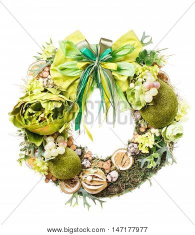 decorative wreath for door with moss and flovers isolated on white