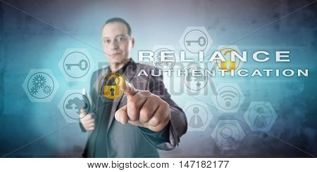 Corporate information security manager with confident face is activating the phrase RELIANCE AUTHENTICATION onscreen. Information technology concept for a multi-factor identity allocation process.
