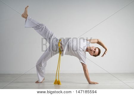 Man practicing capoeira , brazilian martial art.