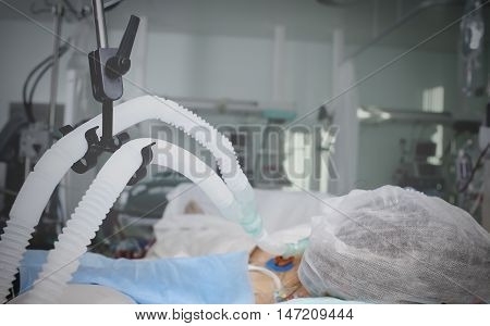 Patient on mechanical ventilation in a coma.