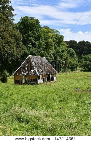 cailly France - june 23 2016 : an old barn in a meadow