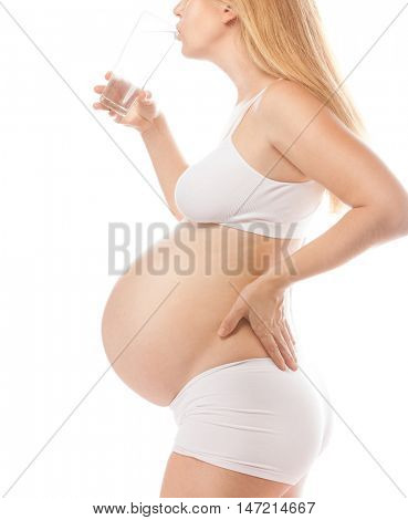 pregnant caucasian woman closeup body isolated on white background studio shot belly thirsty drinking water diet beverage