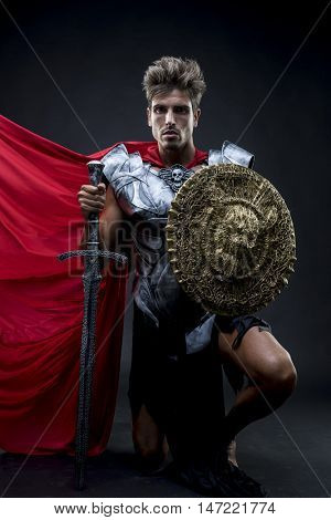 Conqueror, centurion or Roman warrior with iron armor, military helmet with horsehair and sword