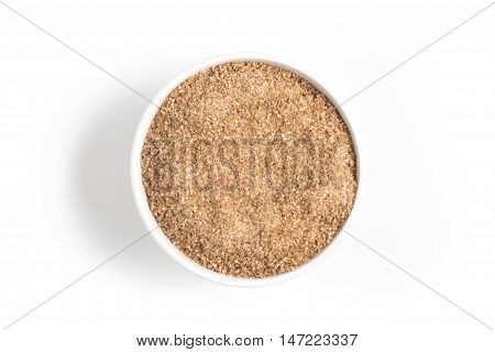 Ground Wheat into a bowl isolated in white background. Trigo para quibe. Kibbeh