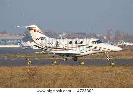 Kiev Ukraine - November 5 2011: Raytheon 390 Premier business jet is taxiing along the runway in the airport