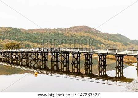 Wooden structure Penmaenpool toll bridge over the River Mawddach near Dolgellau Wales United Kingdom