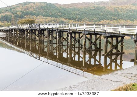 Wooden structure Penmaenpool toll bridge over the River Mawddach near Dolgellau Wales United Kingdom
