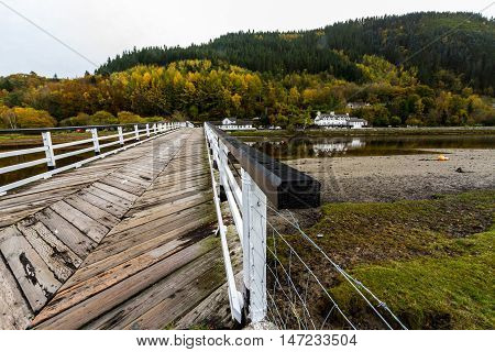 Wooden structure Penmaenpool toll bridge over the River Mawddach near Dolgellau Wales United Kingdom