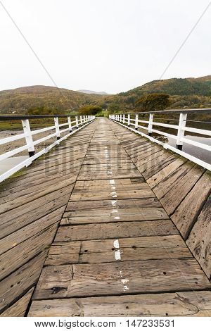 Wooden structure Penmaenpool toll bridge over the River Mawddach near Dolgellau Wales United Kingdom