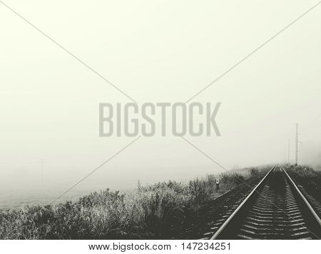 Railway in fog landscape nature field summer autumn morning grass