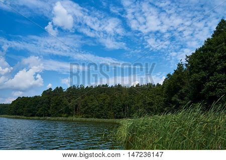 Beautiful panoramic view of the sunset over Lemiet lake in Mazury lake district, Poland. Lake landscape at sunset, fantastic travel destination. Masuria Polish: About this sound Mazury, German: Masuren is a region in northern Poland famous for its 2, 000 