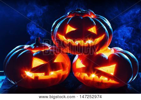 Halloween pumpkin head jack lantern with scary evil faces spooky holiday