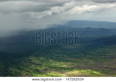 Rain in the Kronotsky Nature Reserve on Kamchatka Peninsula. View from helicopter.