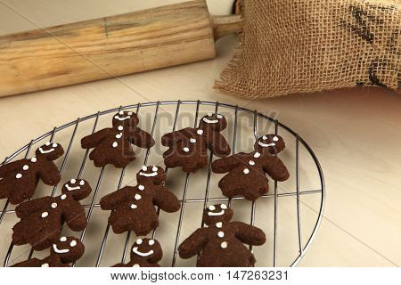Chocolate ginger bread cookies man shape fresh from oven