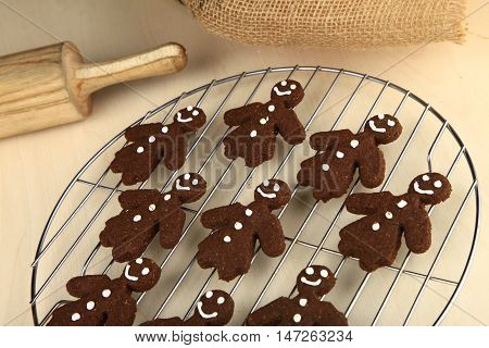 Chocolate ginger bread cookies man shape fresh from oven