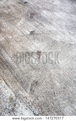 The Step Footprint Of Man On The Concrete Rough Floor Or Ground