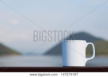 Coffee cup with river and mountain (vintage background)